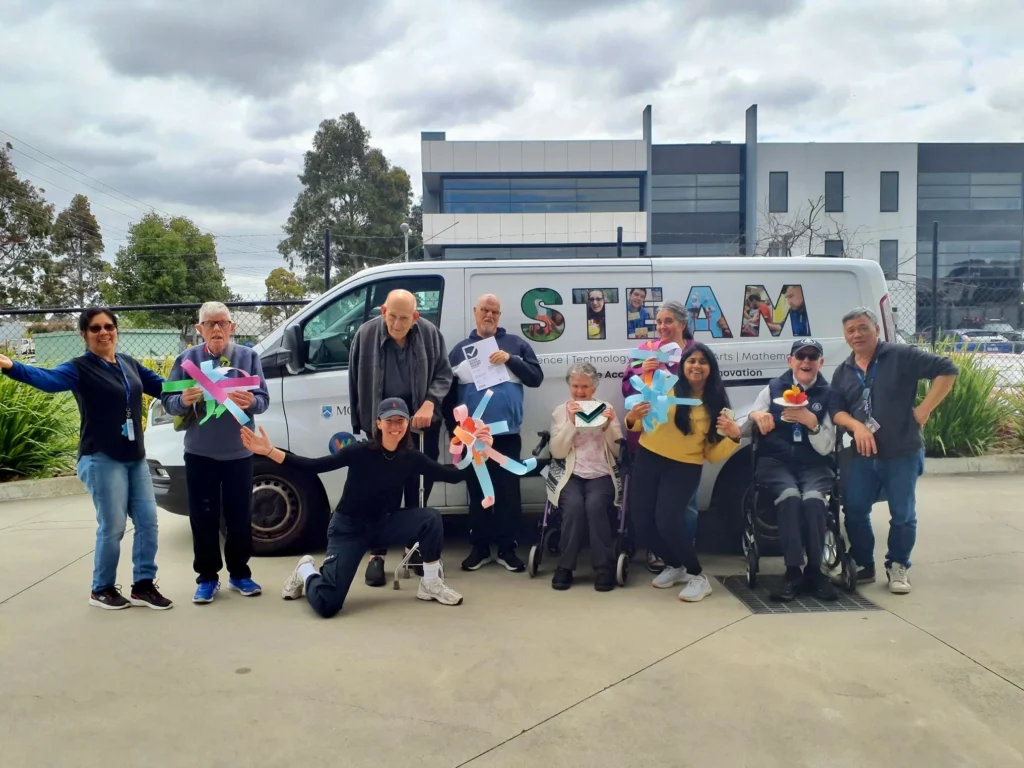 Wallara clients standing in front of the Makervan.