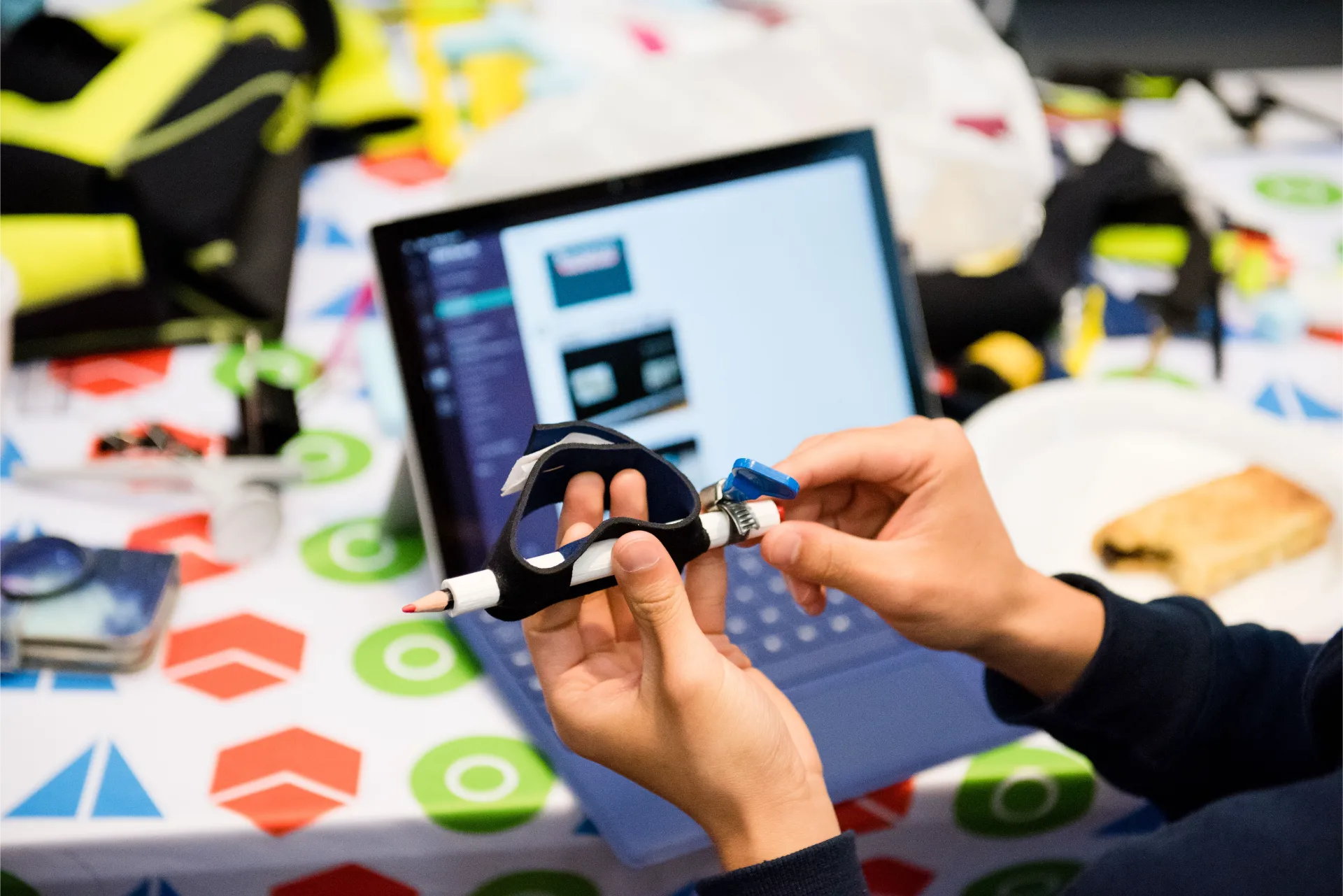 Close up of two hands holding a pen.