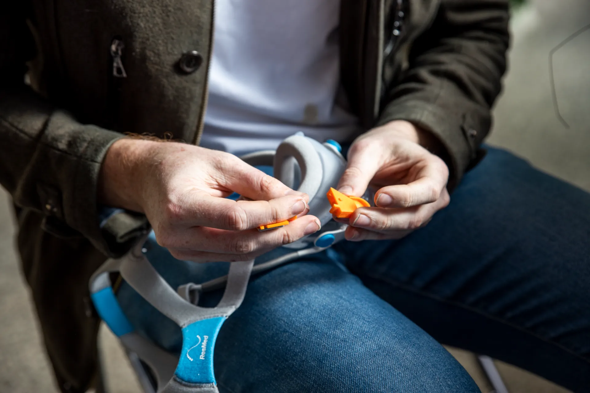 Close up of hands putting to pieces together.