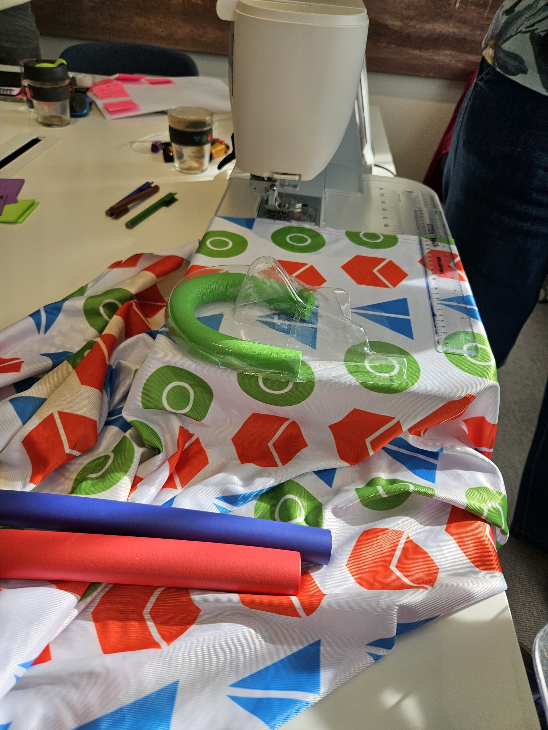 A sewing machine with bits and bobs put together to make a prototype.