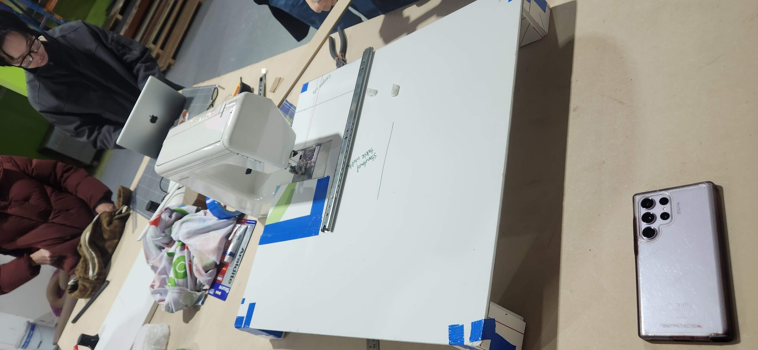 A paper prototype sewing extension table.