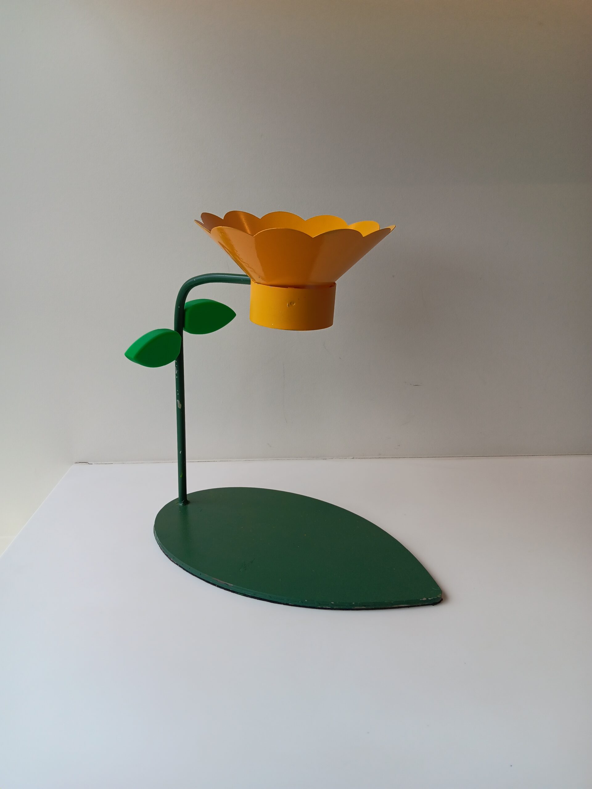 A flower funnel on a metal stand.