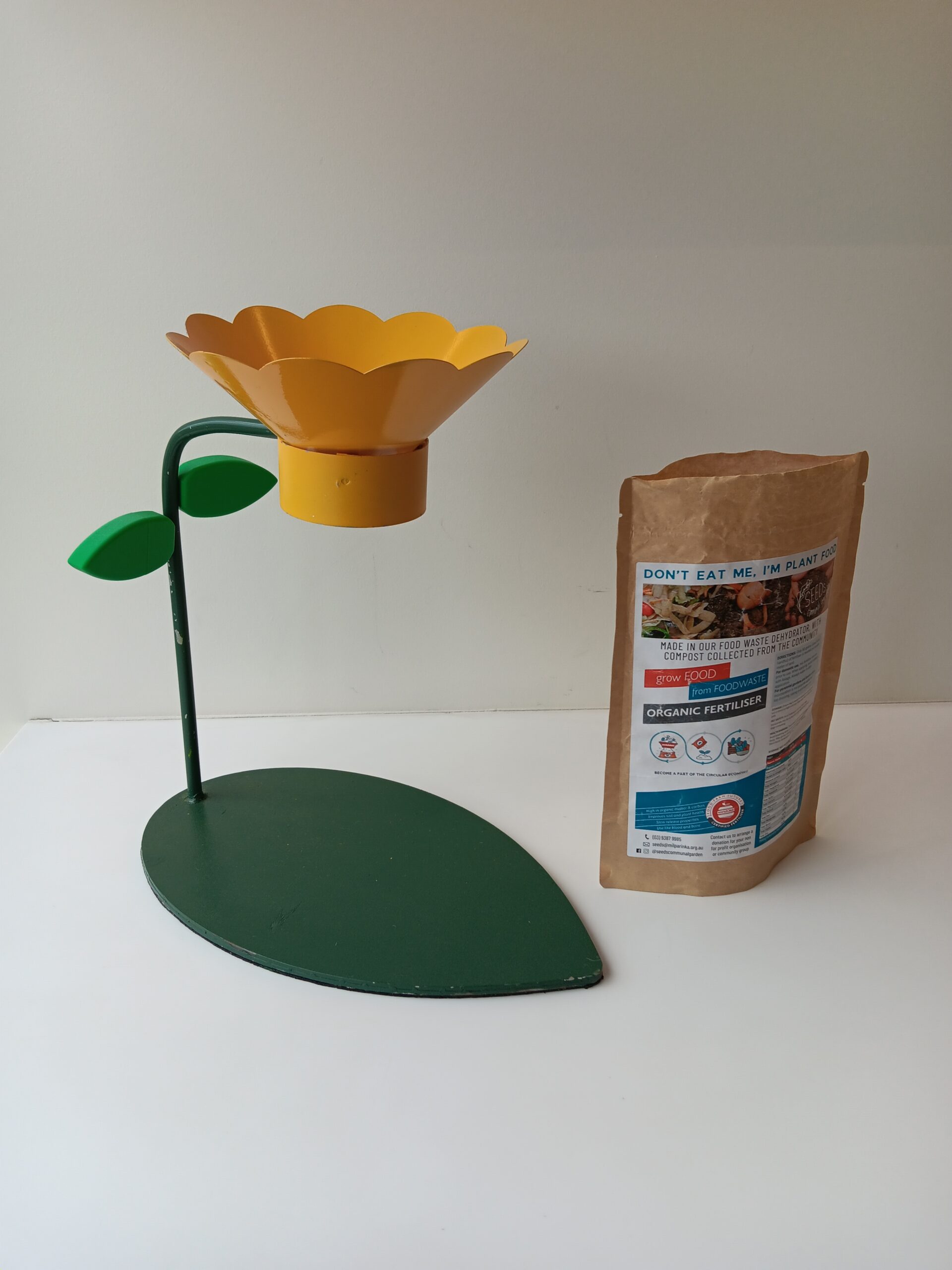 A flower funnel and a paper bag for compost.