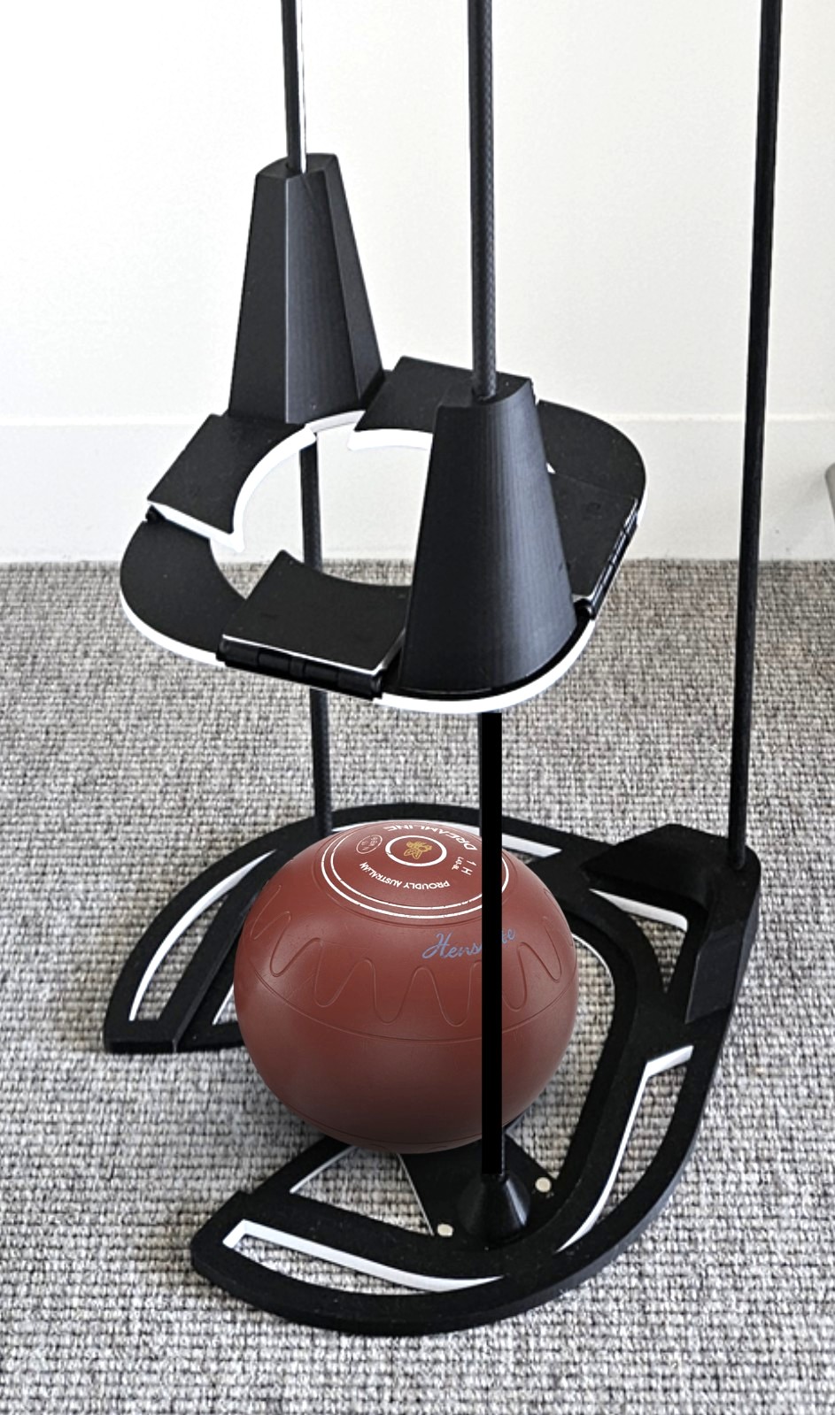 close up view of bowl sitting in base of the powered bowls lifter, with the lifting platform raised above the bowl